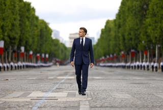 Emmanuel Macron arrives at the Bastille Day military parade in Paris on Monday